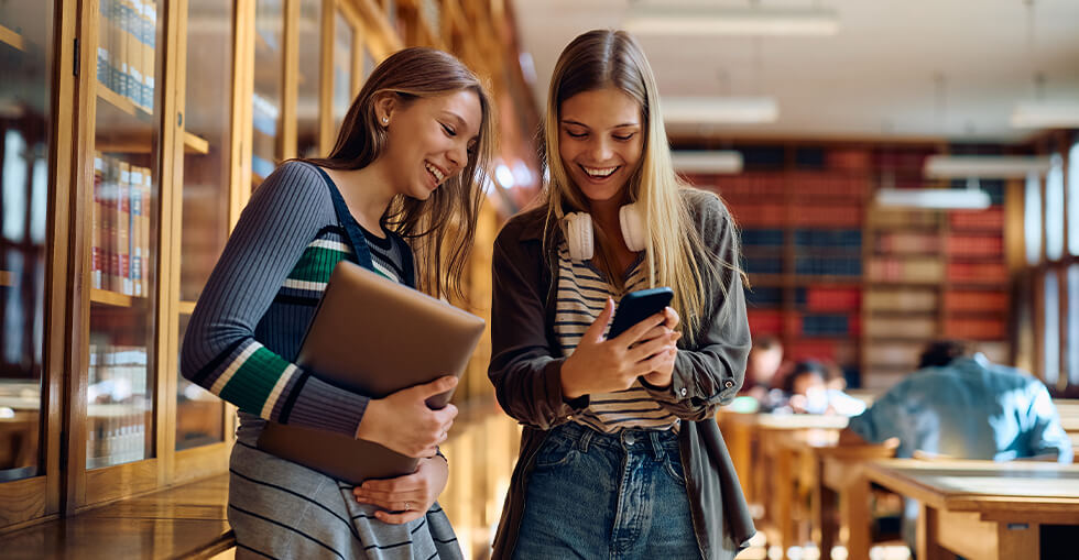 Young women smiling on the phone
